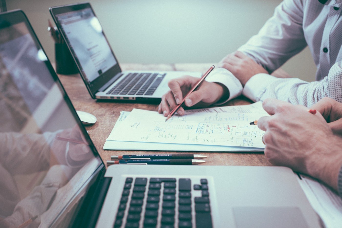 Financial projections and comparables on a desk — DCF and Rule 11UA startup valuation work
